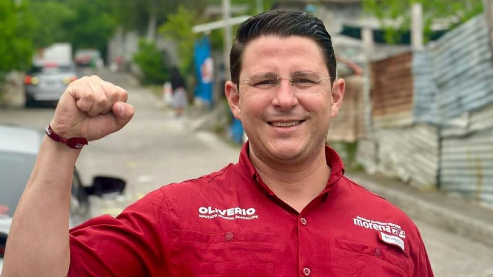 Smiling Man in a Red Work Shirt Raises His Right Fist in a Victory Pose on a Street Background. › Guadalupa Ciudadana