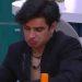 Person Wearing a Dark Blazer Sits at a Desk Indoors, Making a Pouty Facial Expression As if Deep in Thought. › Guadalupa Ciudadana