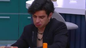 Person Wearing a Dark Blazer Sits at a Desk Indoors, Making a Pouty Facial Expression As if Deep in Thought. › Guadalupa Ciudadana